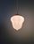 Art Deco pendant light in pressed molded white glass (milk glass) with a brass mount, 1920s-30s. The pendant light has...