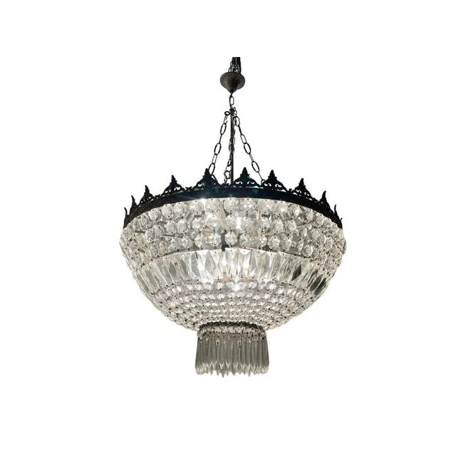 Large crystal chandelier 1950s hanging crystals on a silver colored possibly nickel frame. internal mirror to reflect...