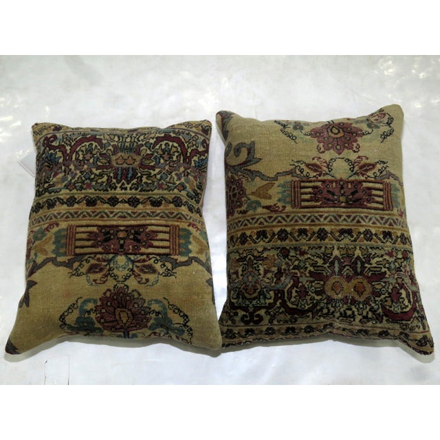 Set of pillows made from a 19th century Persian Kerman rug. Both measure 16'' x 19''.