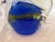 A beautiful hand blown Murano glass fish. It is a dark blue with gold detailing across the body of the fish. The fins and...