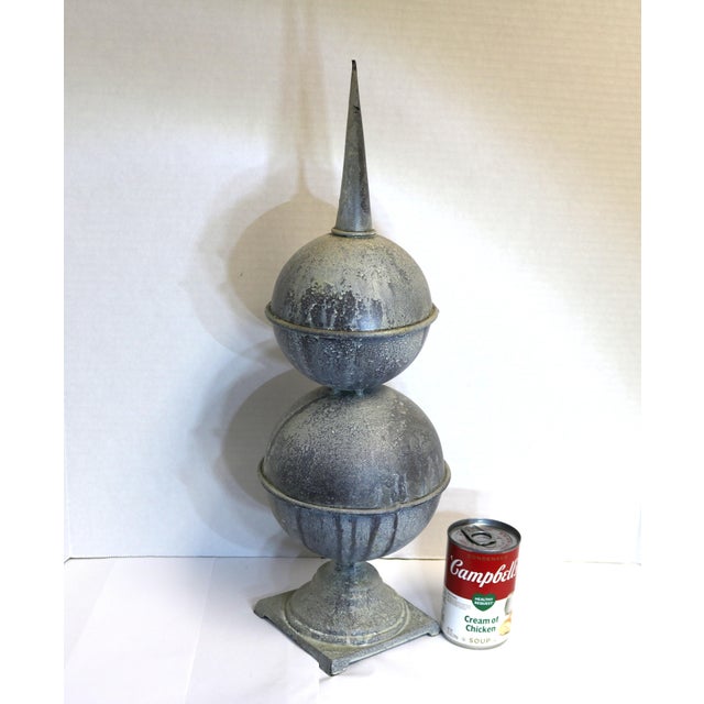 Add this architectural element to your garden or outdoor space. The base is cast iron, the spheres and spire are hollow. A...