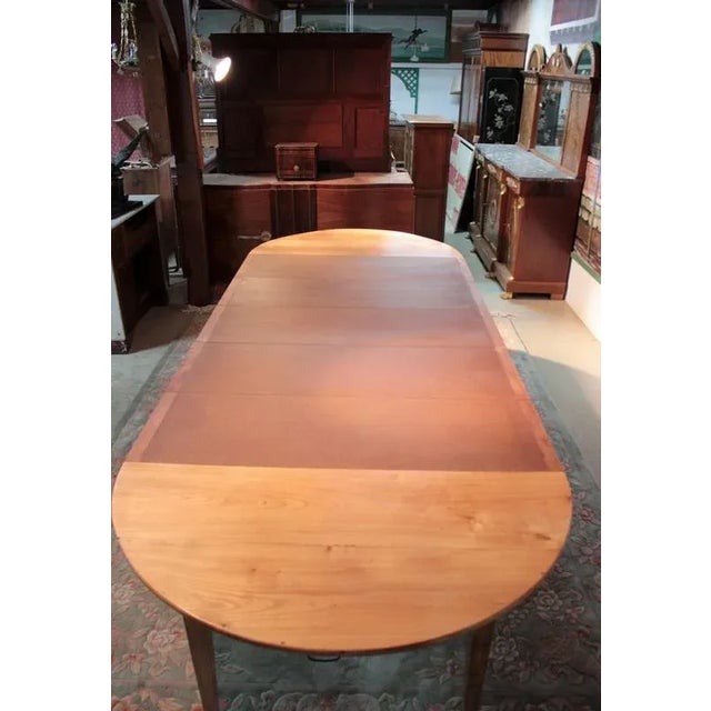 Table oval in very light ash resting on 4 legs sheathed in the Management taste may be associated with contemporary...