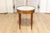 This 20th-century French Bouillotte table exemplifies the timeless elegance of neoclassical design. Crafted from mahogany,...