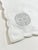 Elegant new old stock cocktail napkins in crisp white cotton with refined silver embroidery, featuring a traditional...