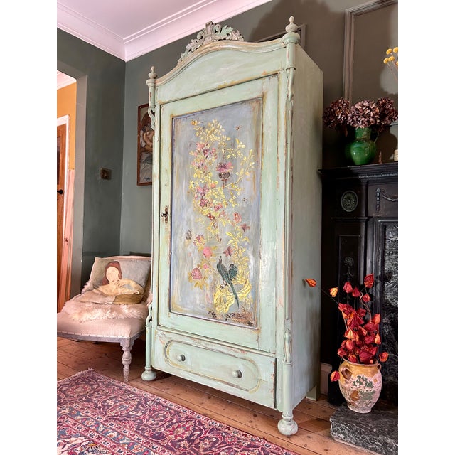 Stunning antique painted armoire, we have added gorgeous chinoiserie to the door panel with an aged patina. The wardrobe...