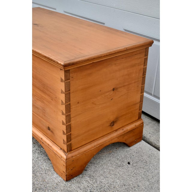 Vintage (1970's) Trunk has a Farmhouse Style. Made of Wood. Solid Pine. The Trunk has a Hinged Lid, Key Included, and a...