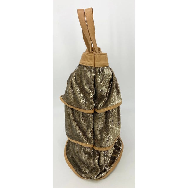 Red Valentino Gold Sequin Ruffle Tote in fair condition. Three ruffled layers of gold sequins over a beige canvas tote...