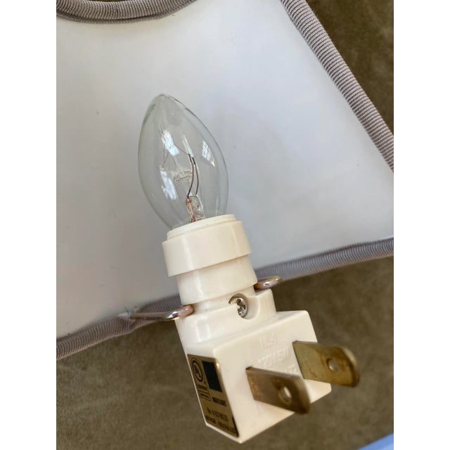 A nightlight made with Fortuny’s iconic hand printed cotton.