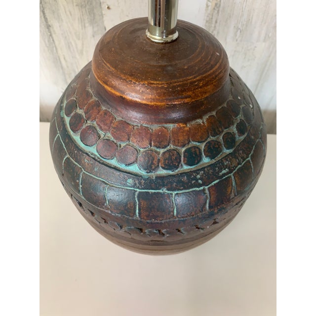 Earth tone design for that rustic modern vibe, rich brown with turquoise accents. The top of the socket is 17" high.