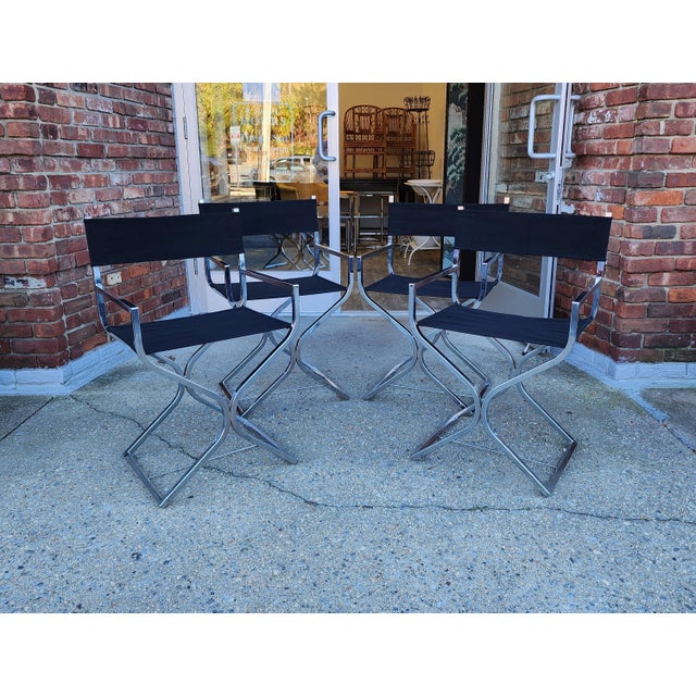 A vintage set of 4 chrome" X" directors chairs with new black canvas seats and backs. These chairs are from the 1960's and...
