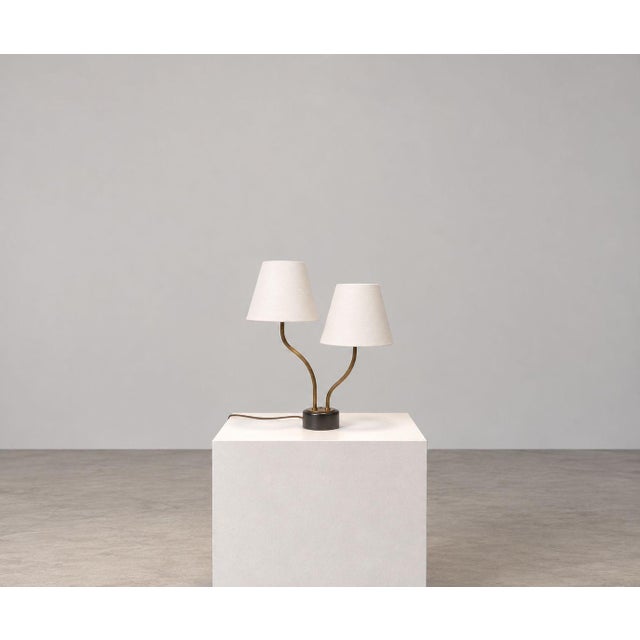 Swedish Mid-Century Modern, Two-Arm Table Lamp, Brass, Black Painted Wood, Sweden, 1950s An organic modern two-arm table...