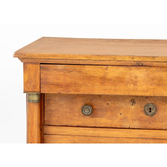 French Empire Mahogany Chest of Drawers, with four long drawers flanked by brass mounted columns. 36" H x 46.5" W x 24" D....