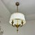 French Empire style gold bronze chandelier, France 1950s. Gold bronze spherical body pierced with an arrow, three arms...