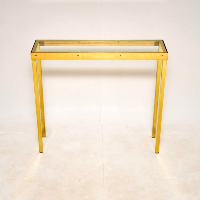A stylish and incredibly well made vintage solid brass and glass console / side table. This was made in England, it dates...