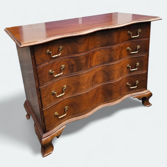 This 18th Century Chippendale Oxbow Chest of Drawers is a magnificent Georgian era example of Chippendale style. Beginning...