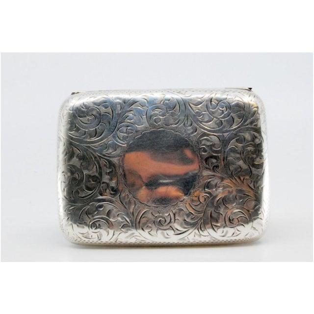 Silver Cigarette Case with Engraved Floral Motifs and Hinged Lid, in Very Good conditions. Designed 1920 to 1949 This...