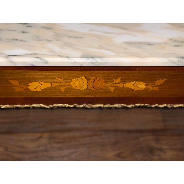 Vintage, Antique coffee table decorated with brass and antique art work. Removable top.