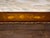 Vintage, Antique coffee table decorated with brass and antique art work. Removable top.