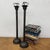 "About This Piece About This Piece Tall, elegant, and steeped in quiet ritual, this pair of antique bronze candlesticks...