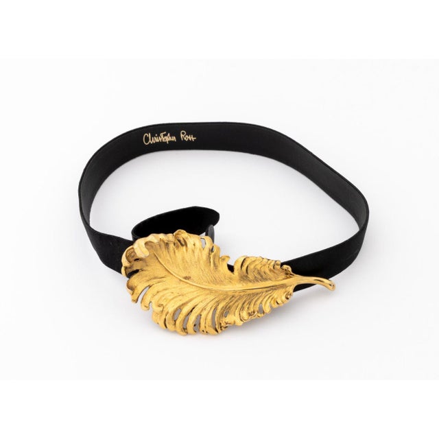 Christopher Ross Gold Plate Feather Form Belt Buckle and Black Silk Belt, 1986, signed and marked to reverse. 35.25" L x...