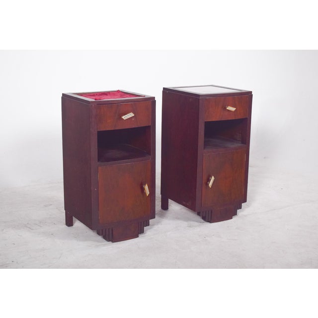 Pair of Deco-style bedside tables. with firm geometric lines and symmetrical details, each piece has a well-defined...