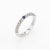 Elegant Adolfo Courrier stacking ring, crafted in 18 karat white gold. One estimated 0.05 carat sapphire, accented with 36...