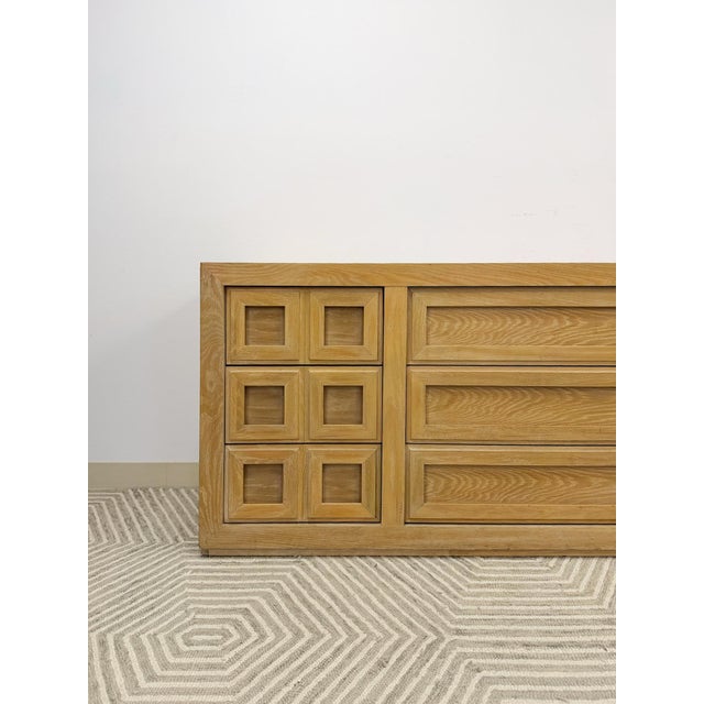 This substantial vintage Thomasville blonde oak 9-drawer dresser is a well-made and attractive bedroom staple. The warm...