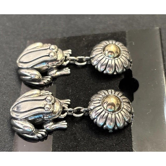 These Barry Kieselstein Cord Sterling Silver & 14K Gold Earrings features a playful design of frogs and flower, perfect...