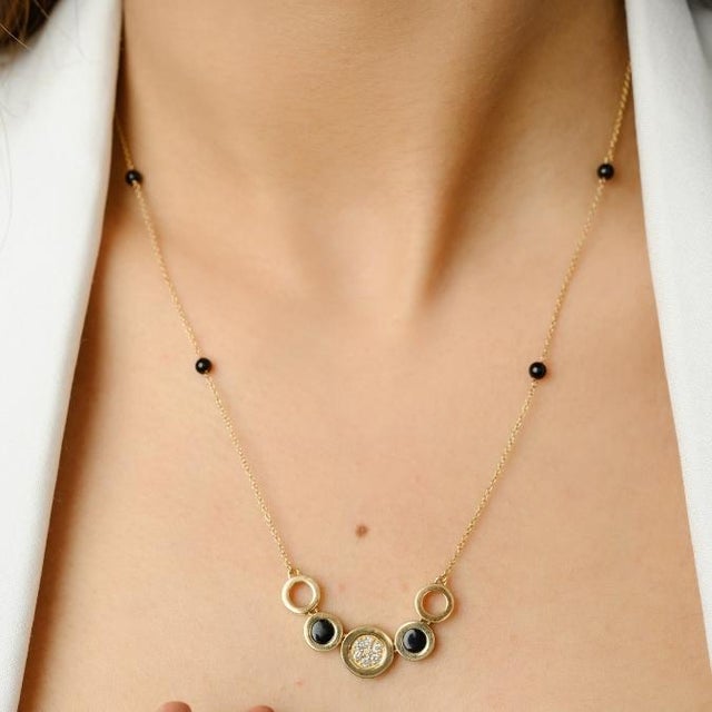 This is part of Chairish’s Fine Jewelry assortment. Unique Black Onyx and Diamond Chain Necklace in 14K gold studded with...