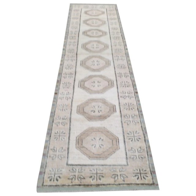 Hand-knotted with care using traditional rug making techniques, this wool rug blends timeless craftsmanship with a modern...