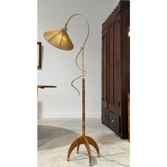 Unique Split Reed Rattan and Faux Finished Metal Sculptural Floor Lamp Absolutely striking floor lamp with a rope-wrapped...