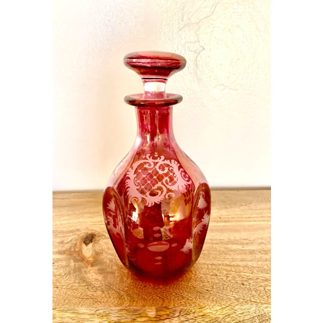 Beautiful vintage hand etched pink glass decanter with two different designs Stopper: 2.75”h x 2.25”d Base height; 8” No...