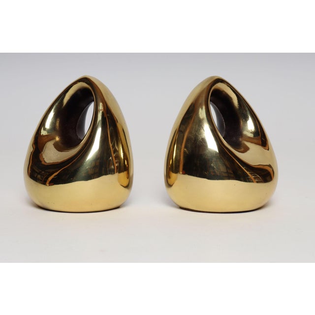 Sculptural bulbous tear drop-form with cutout bookends designed by Ben Seibel for Jenfred Ware (ca. 1950s, USA). Very...