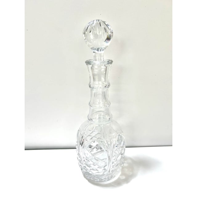 Vintage cut crystal decanter with faceted stopper and brilliant light-reflecting pattern, perfect for whiskey, bourbon, or...