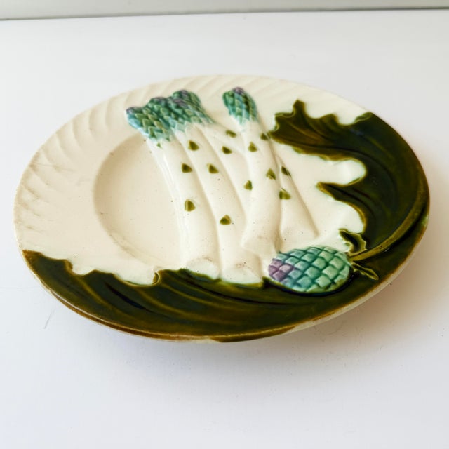 Beautiful antique French majolica asparagus plate by Salins-les-Bains, France, dating to circa 1890. Featuring raised...