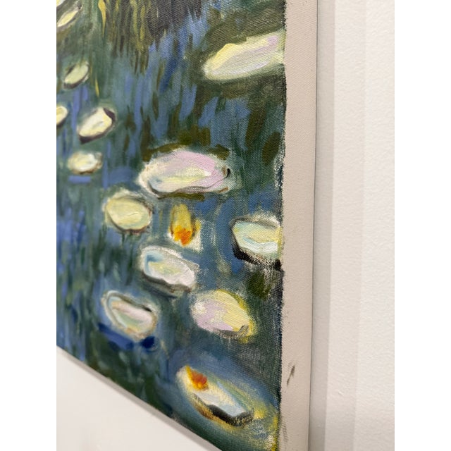 An impressionist-style study of a tranquil pond scene. Dappled greens and blues create a lush, painterly backdrop, while...