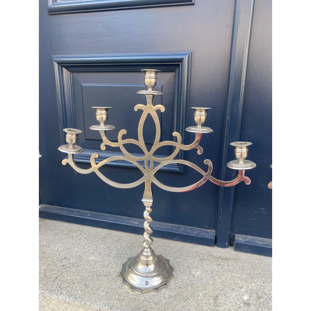 matched pair of five-light candelabra with tilted brass