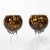A pair of long stemmed goblets with tortoise shell bowls and long clear stems.