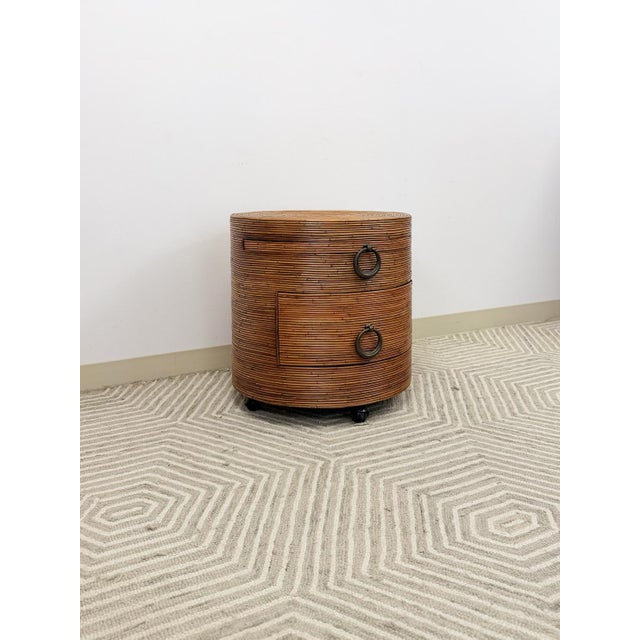 This gorgeous vintage pencil reed ribbed round rolling side table is a highly covetable and on-trend decorative find. The...