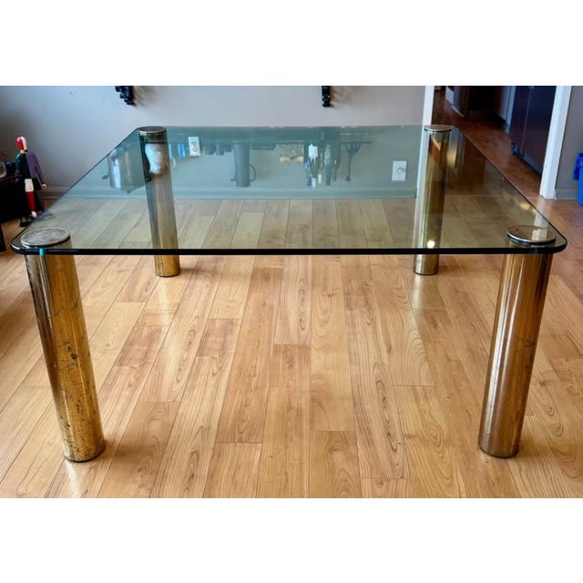 1970’s Leon Rosen for Pace Collection brass and glass dining table. Minimalist, sleek and modern glass and brass plated...