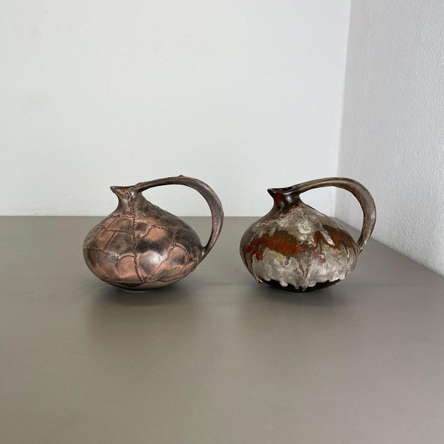 Article: set of 2 vases. Design: Kurt Tschörner. Producer: Ruscha, Germany. Decade: 1960s : This original vintage vase set...