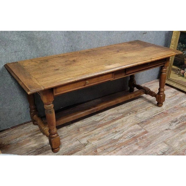 A louis xiii style center table or desk in solid oak, circa 1850. features two drawers in the apron. turned legs with a...