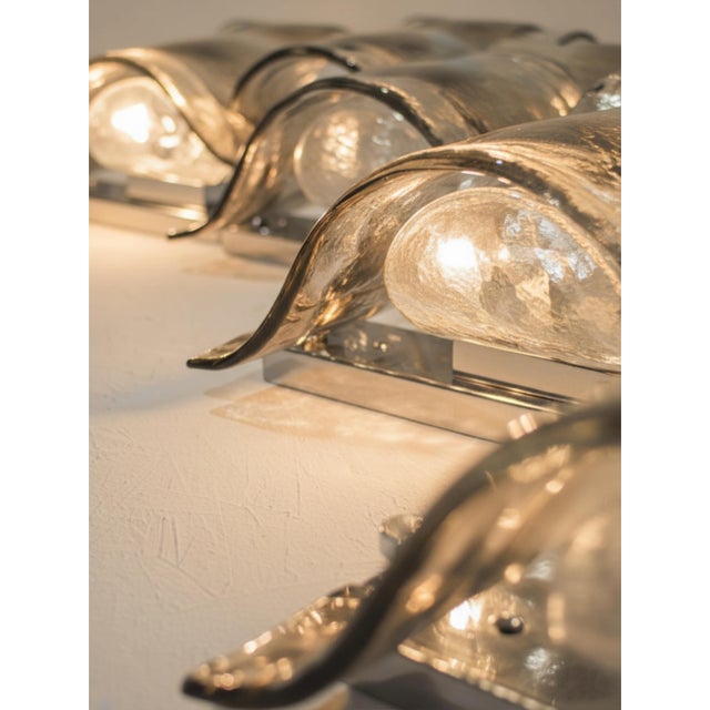 Each sconce has 2 bulbs, a set of two and four are already wired together but they can be rewired based on how you wish to...