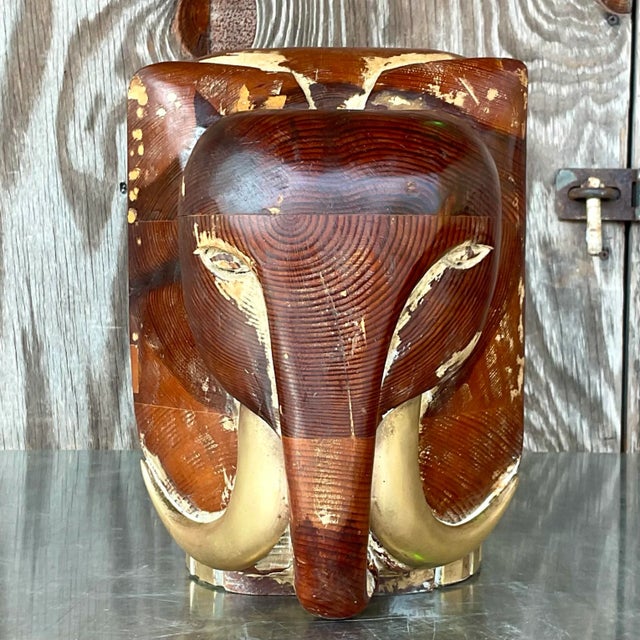 A stunning vintage 90s carved wooden elephant. A chic little fella made from carved wood with brass hardware. Beautiful...