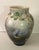 Delicately hand painted opaline glass urn shape vase. Branches of wisteria, a blue jay and butterfly depicted on an ombre...