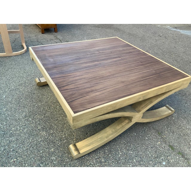Modern custom coffee table. Table has a unique custom finish. Top inset is walnut. The table is made of solid alder and...