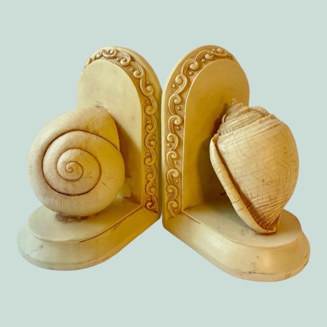 Gorgeous cream colored molded resin shell bookends 70's Height: ~7.25 inches (from the base to the top of the scrollwork...