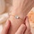 Elevate your everyday elegance with this minimalist East-West gemstone bracelet, designed to showcase understated luxury...