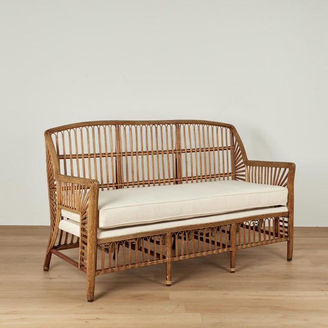 Tropical luxury art deco sofa handcrafted in streamline form with an upholstered seat. Tagged La Parisien M. Casas on the...