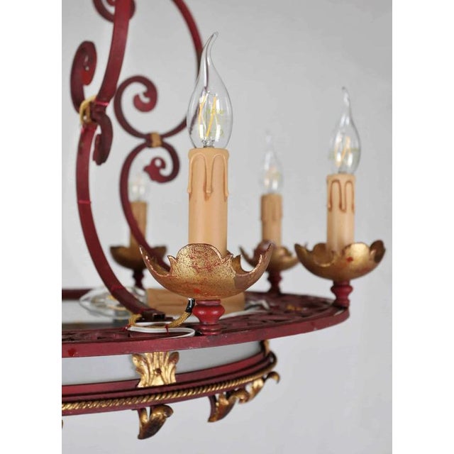 Large circular chandelier with 11 bulbs. The chandelier is hand-forged with a central frosted glass. Completely new...